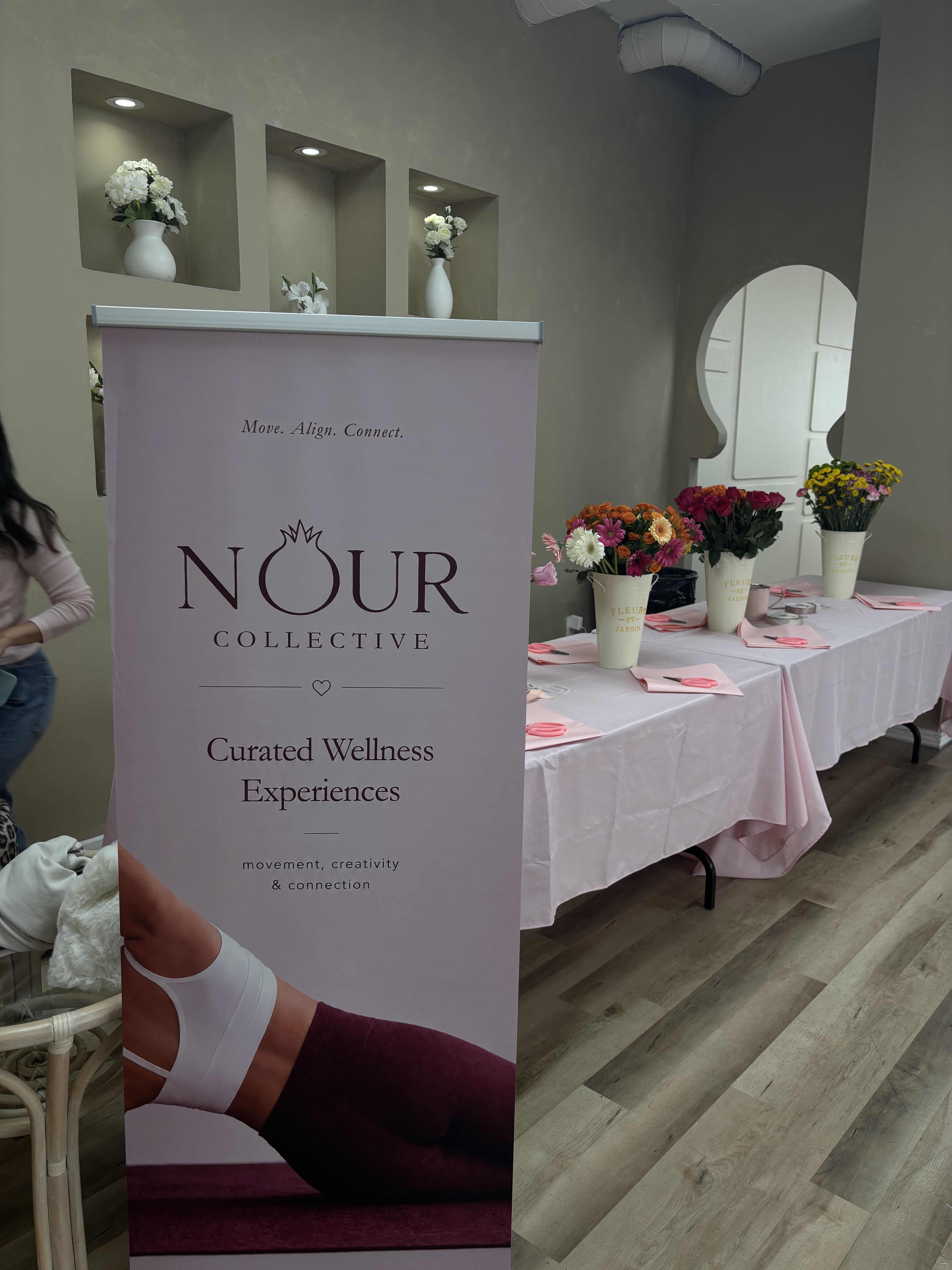Nour Collective banner at the event