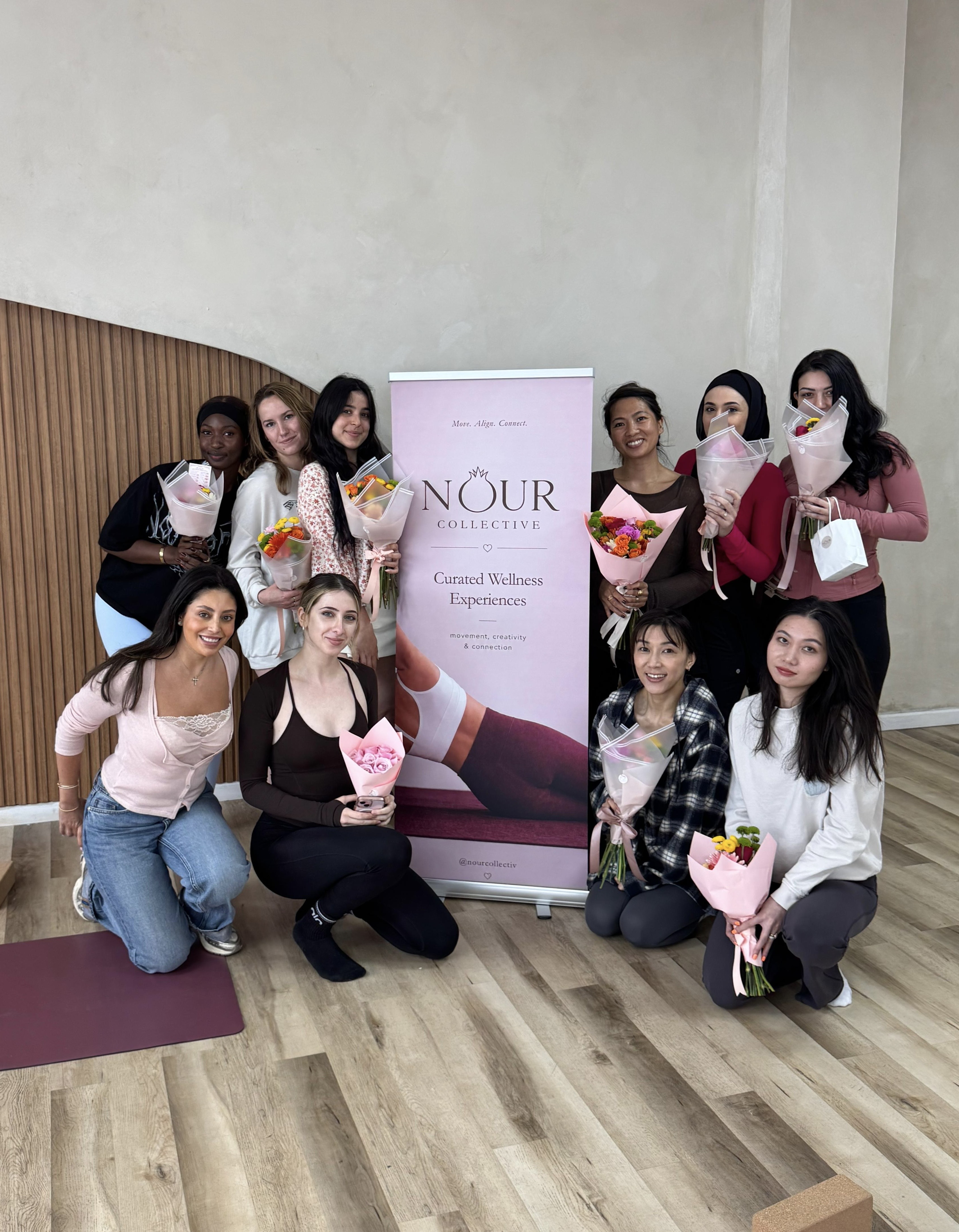Group photo with finished bouquets at Bloom & Align